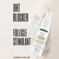 A bottle of scalp and hair science DHT blocker spray shown on a light beige background with water splash graphics and large text reading 'DHT BLOCKER' and 'FOLLICLE STIMULANT'.