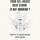 Promotional graphic for a hair serum bottle with large text reading 'YOUR OIL-BASED HAIR SERUM IS NOT WORKING?' and 'SWITCH TO WATER-BASED HAIR SERUM.' The bottle is centered against a white splash effect, with 'makeu.